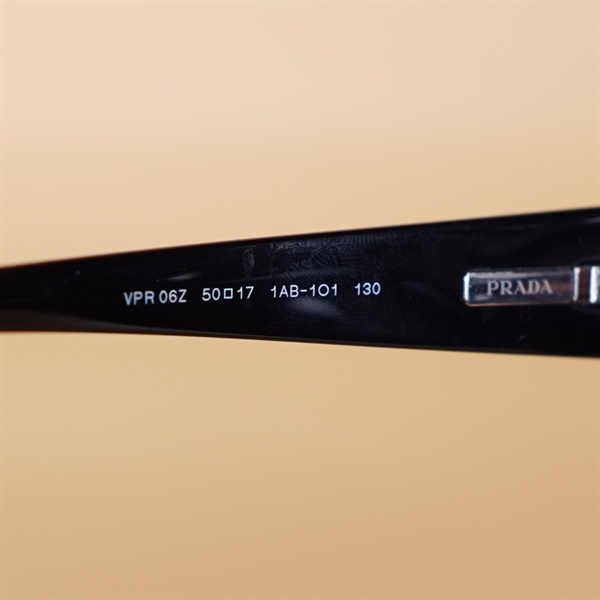 Kính Prada VPR06Z elip viền đen KG+