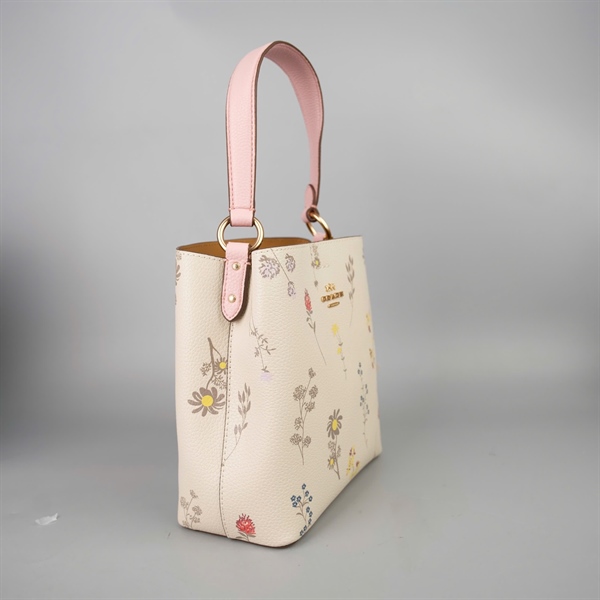 Túi Coach Bucket trắng in hoa sz20 +