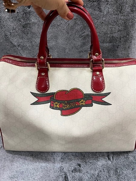 Túi GC trắng hoạ tiết nỏ đỏ viền đỏ +