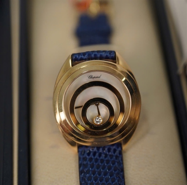 Đồng hồ Chopard mặt tròn vàng dây xanh (4173) KG+