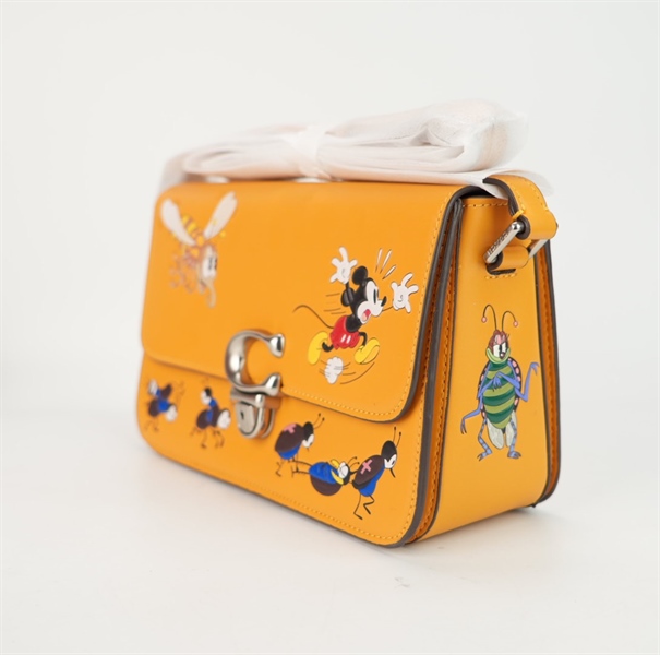 Túi Coach Disney màu vàng kèm chìa sz25 +