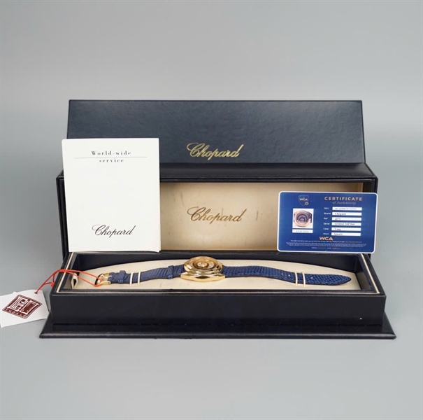 Đồng hồ Chopard mặt tròn vàng dây xanh (4173) KG+
