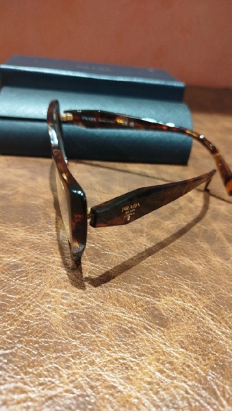 Kính Prada gọng nâu loang KG+